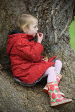 Girl in tree with chocolate egg