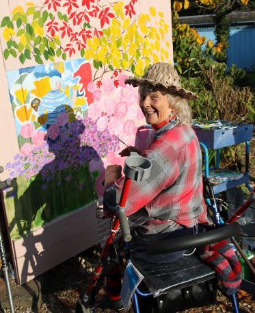 Sheila Horton painting the Old Rectory gate